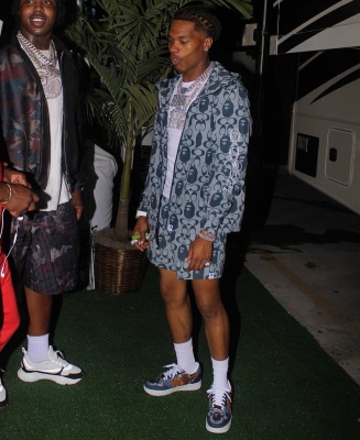 Lil Baby Wearing A Bape X Coach Jacket And Shorts With Bape X Coach Sneakers