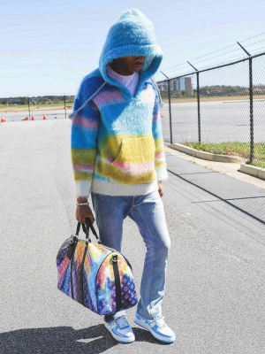 Lil Baby Wearing A Celine Blue Multicolor Baja Hoodie With Gallery Dept Jeans A Louis Vuitton Bag And Bape Sneakers
