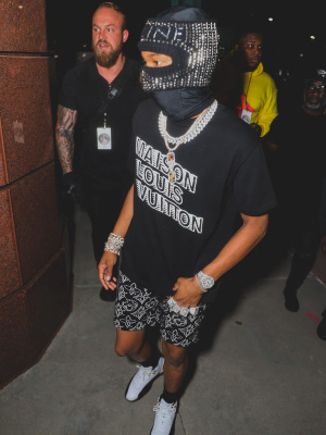 Lil Baby Wearing A Celine Studded Mask With Louis Vuitton Tee And Shorts And Jordan Sneakers