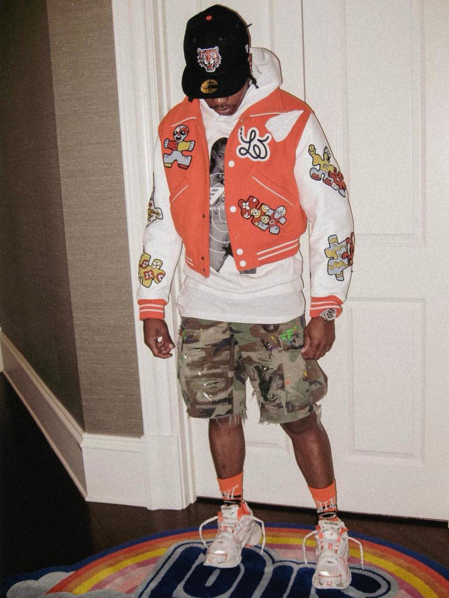 Lil Baby Wearing an Orange Varsity Jacket With Camo Short & Matching Sneakers Outfit