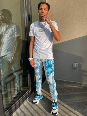 Lil Baby Wearing A Dior White T Shirt With Amiri X Chemist Jeans Amiri Keyring And Dior B22 Sneakers