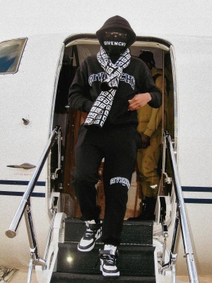 Lil Baby Wearing A Givenchy Beanie Sweatshirt Scarf And Sweatpants With Nike X Stussy Sneakers