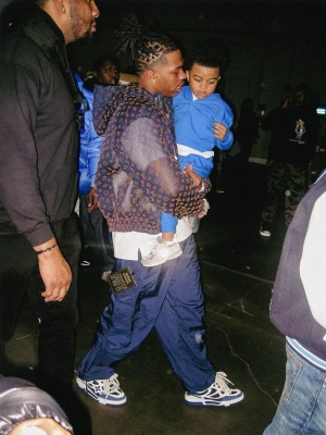 Lil Baby Wearing A Louis Vuitton Navy Mesh Jacket And Pants With Low Top Skate Sneakers