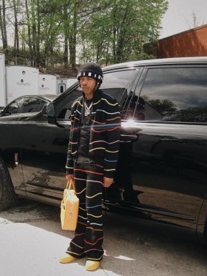Lil Baby Wearing A Marni Striped Track Jacket And Pants With A Goyard Bag And Nike Sneakers