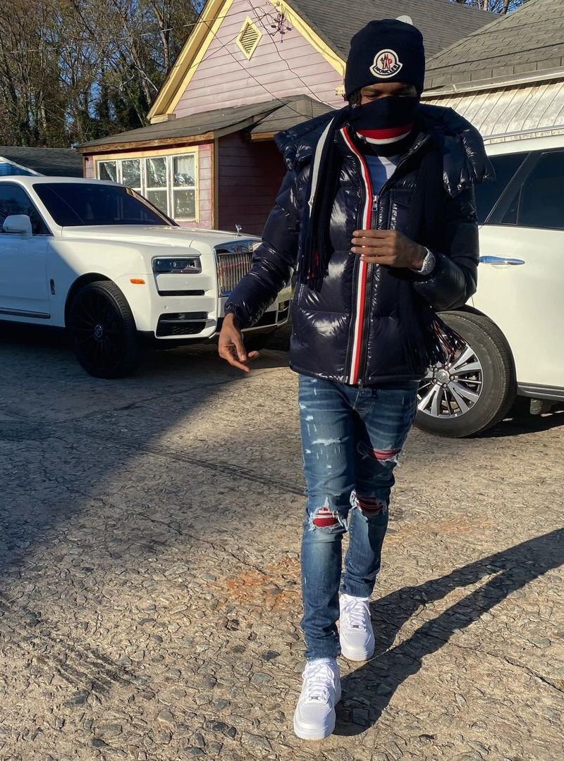 Lil Baby Wearing a Moncler Beanie, Scarf, and Puffer With Amiri Jeans & Nike AF1s