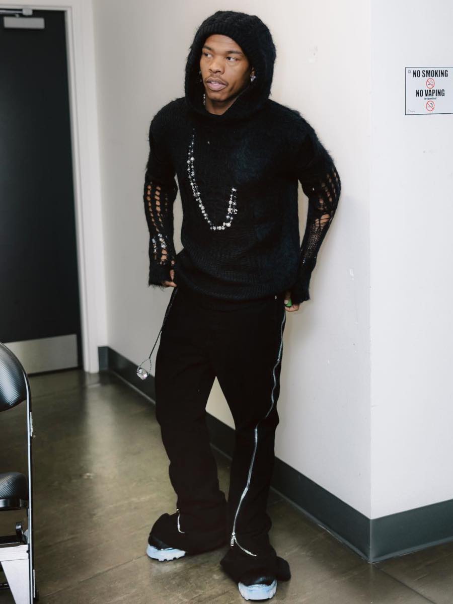 Lil Baby: Black Destroyed Hoodie, Black Zip Flared Jeans & Fur Boots