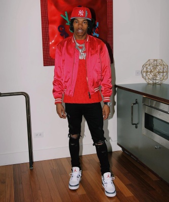 Lil Baby Wearing An Dior X Shawn Red Satin Bomber Jacket With A Dior Oblique Tee Black Jeans And Jordan 3 Retro Sneakers