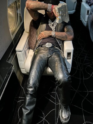 Lil Durk Wearing A Chrome Hearts Beanie Oversized Sunglasses Leather Vest Belt Pants And Lv Boots