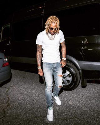 Lil Durk Wearing A White T Shirt Jeans And White Leather Side Striped Sneakers By Prada