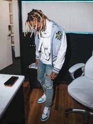 Lil Durk Wearing An Off White Varsity Jacket With A Louis Vuitton Tee Amiri Jeans And Sneakers