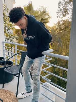 Lil Mosey Wearing A Balenciaga Slime Hoodie With Ksubi Dollar Sign Jeans And Alexander Mcqueen Sneakers