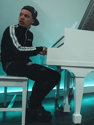 Lil Mosey Wering A Palm Angels Track Jacket Black Jeans And Balenciaga Allover Logo Triple S Sneakers