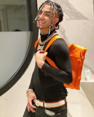 Lil Pump Smiles For The Camer In Louis Vuitton Backpack And Belt