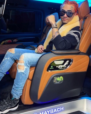 Lil Pump Wearing Fendi Sunglasses With A Dior Sweater Bleached Jeans And Jordan Sneakers