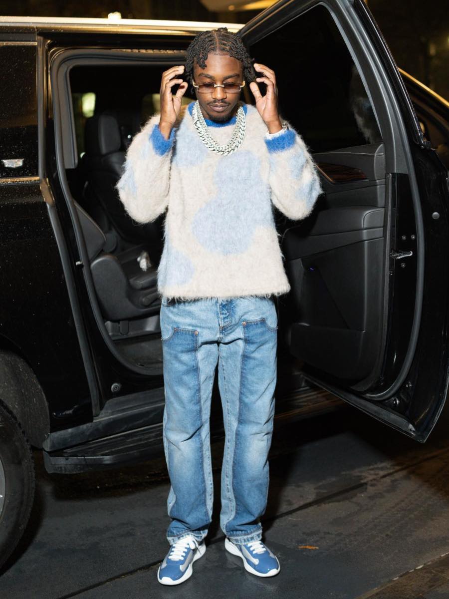 Lil TJay: Ivory & Blue Cow Sweater, Washed Carpenter Jeans & Prada Sneakers