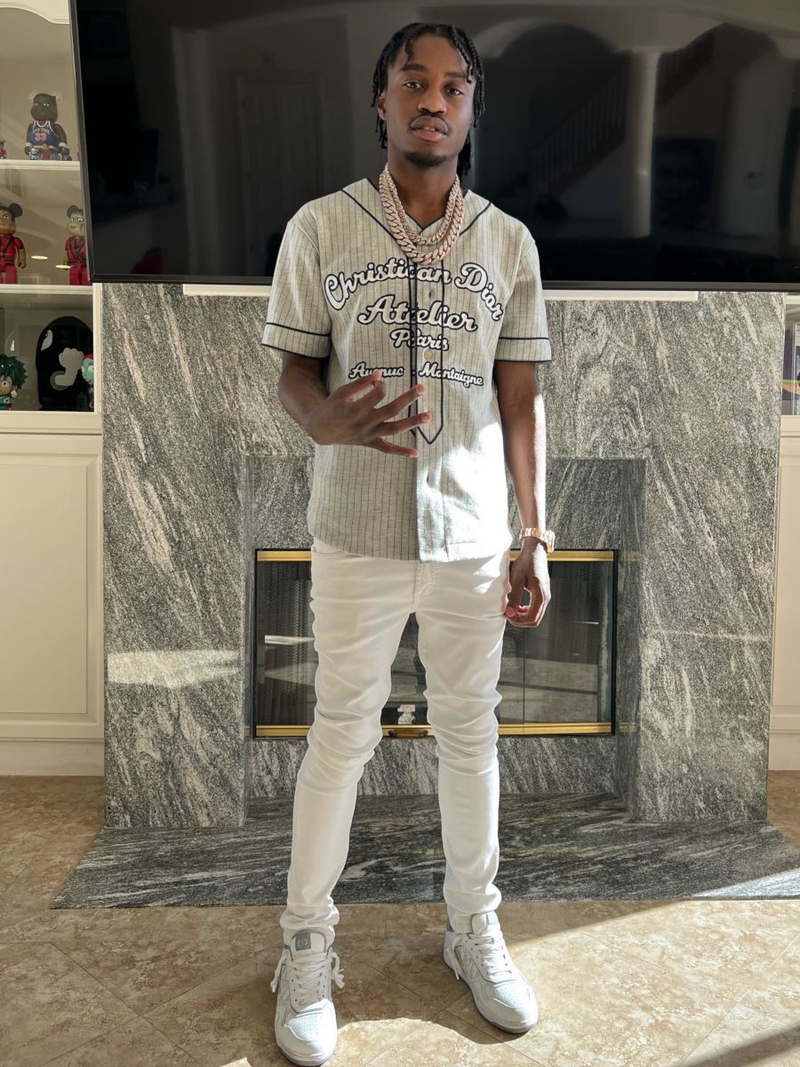 Lil TJay Wearing a Dior Baseball Jersey & Low-Top Sneakers With Amiri Jeans