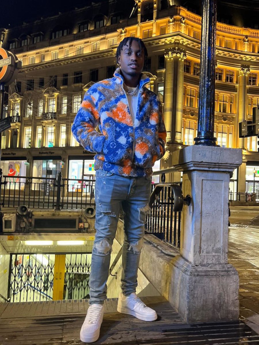 Lil TJay Checks Out London England In a Louis Vuitton Fleece & Amiri Jeans