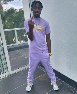 Lil Tjay Wearing A Palm Angels Teddy Bear Tee With Lavender Trackpants And Dior B22 Sneakers