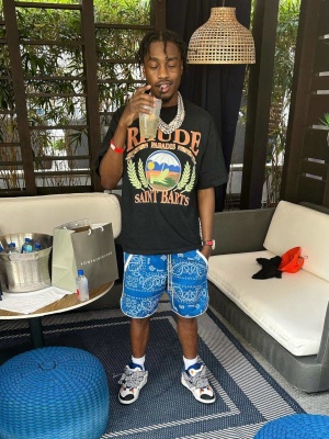 Lil Tjay Wearing A Rhude Black Logo T Shirt With Blue Bandana Shorts And Lanvin Sneakers