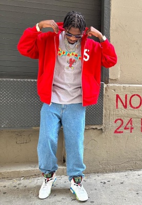 Lil Tjay Wearing A Supreme Red S Logo Hoodie Grey Dynamite Tee Blue Flower Jeans And Jordan Sneakers