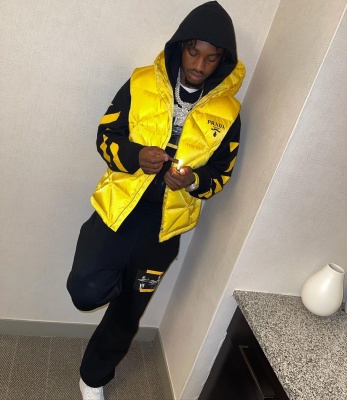Lil Tjay Wearing An Off White Caravaggio Hoodie And Sweatpants With A Prada Puffer Vest