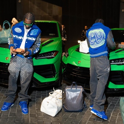 Lil Tjay Wearing Bottega Veneta Green Sunglasses With A Louis Vuitton Varsity Jacket Monogram Jeans And Blue Sneakers