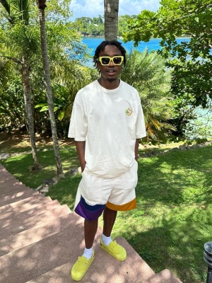 Lil Tjay Wearing Yellow Sunglasses With A Marni Tee Colorblock Shorts And Dior Mules
