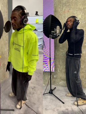 Lil Uzi Vert Wearing A Balenciaga X Wfp Yellow Hoodie With A Black Gloved Mock Shirt Balenciaga Sporty B Sweatpants And Destroyed Sneakers