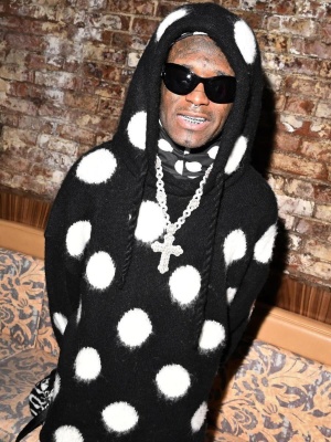 Lil Uzi Vert Wearing A Marc Jacobs Knit Hoodie And Balaclava And Faux Fur Monogram Dufle Bag