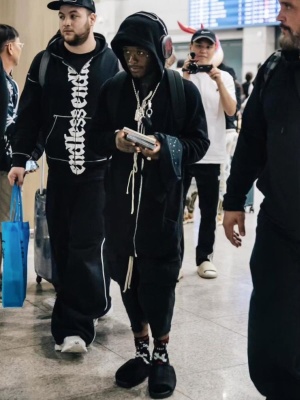Lil Uzi Vert Wearing A Rick Owens Hoodie Shorts And Slides With A Balenciaga Backpack
