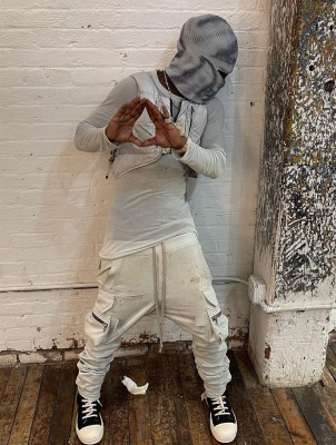 Lil Uzi Vert Wearing A Tie Dye Balaclava With A Moncler X Alyx Vest Rick Owens Tee And Joggers