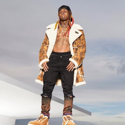 Lil Wayne Wearing A Bape X Ugg Sherling Jacket And Shoes With Amiri Palm Tree Print Black Jeans