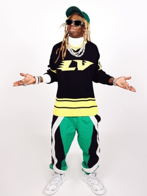 Lil Wayne Wearing Off White Sunglasses With A Louis Vuitton Hockey Jersey Trackpants And Sneakers