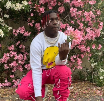 Lil Yachty Wearing Neon Pink Bungee Cord 99%is Pants And A Grey Crewneck
