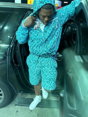 Lil Zay Osama Wearing A Louis Vuitton Jacket And Shorts With Nike Af1s