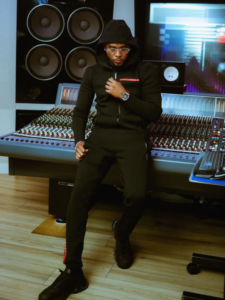 London In The Studio Wearing an All Black Prada Linea Rossa Outfit
