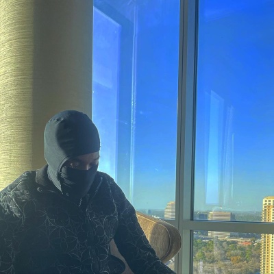 Meek Mill Wearing A Black Ski Mask And Louis Vuitton Track Jacket