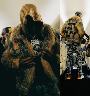 Meek Mill Wearing A Louis Vuitton Fur Jacket With A Black Maison Lv Tee Amiri X Chemist Cargo Pants And Louis Vuitton Sneakers