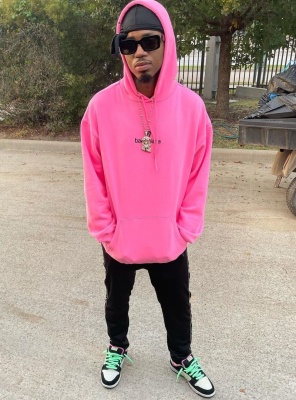 Metro Boomin Wearing Louis Vuitton X Nigo Sunglasses With Balenciaga Pink Hoodie And Nike Poison Dunks