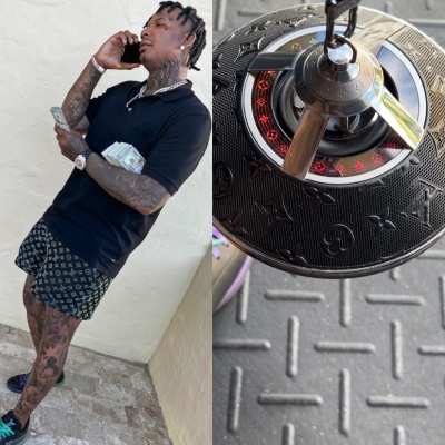 Moneybagg Yo Wearing A Black Knit Polo Shirt With Louis Vuitton Shorts And Louis Vuitton Sneakers