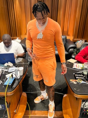 Moneybagg Yo Wearing A Gallery Dept Orange Long Sleeve Tee And Shorts With Bape Orange Sneakers