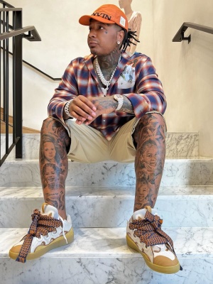 Moneybagg Yo Wearing A Lanvin Orange Hat With A Check Shirt And Lanvin Curb Sneakers