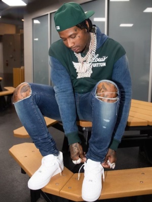 Moneybagg Yo Wearing An Louis Vuitton Green And Denim Logo Hoodie With Amiri Broken Jeans And Nike Air Force 1 Sneakers