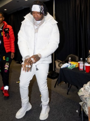 Moneybagg You Wearing A Moncler White Logo Headband And Puffer Jacket With Alexander Mcqueen Treadslick Boots