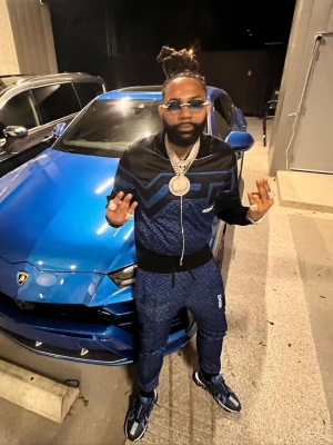 Moneyman Wearing A Versace Black And Navy Geometric Track Jacket And Trackpants With Versace Blue Sneakers