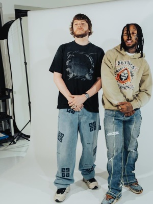 Murda Beatz Wearing A Givency Black Logo Tee With 4g Jeans And Black White Two Tone Sneakers