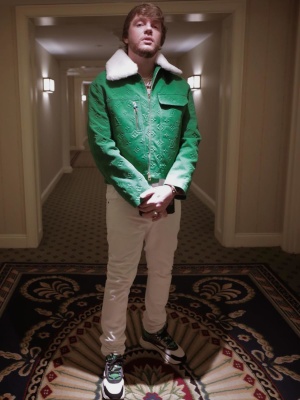 Murda Beatz Wearing A Louis Vuitton Green Denim Jacket With White Jeans And Dior B22 Sneakers