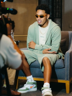 Myke Towers Wearing A Helmut Lang Green Zip Hoodie And Shorts With Nike Air Force 1s
