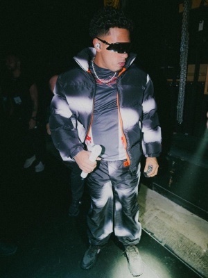 Myke Towers Wearing A Heron Preston Puffer Racing Jersey And Trackpants