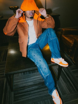 Myke Towers Wearing A Louis Vuitton Workwear Jacket With Carpenter Jeans And Lv Trainer Sneakers